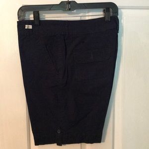 Navy blue shorts. Two button back pockets. Cute.